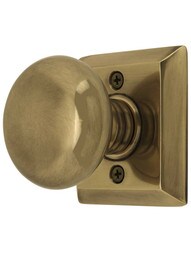 Quincy Rosette Door Set with Providence Knobs in Antique Brass.